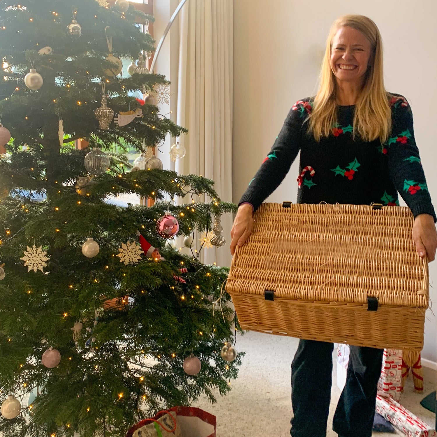 christmas jumper woman with positively hampered hamper basket